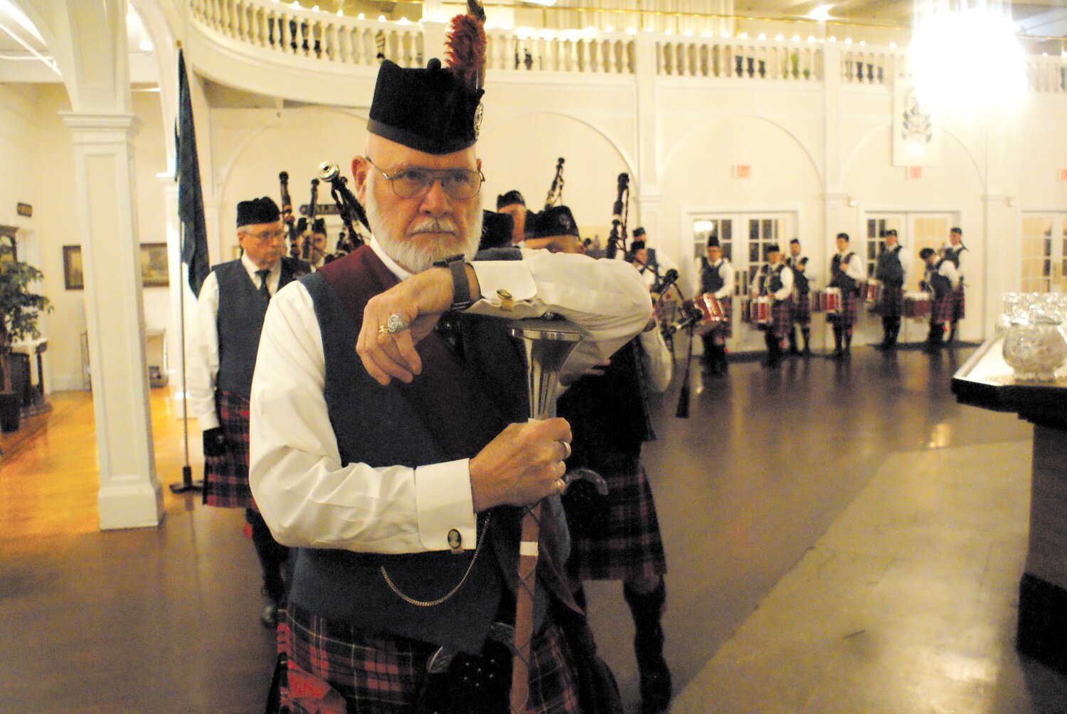 Scottish cultural event at Robert Burns Dinner Dance: The Rhode Island Highlanders stand ready with drum major in the lead in the hall at Rhodes on the Pawtuxet. The sixtieth annual Robert Burns Dinner Dance celebrates the Scottish poet Robert Burns, writer of the famous Auld Lang Syne. See page 10 for more photos. (Cranston Herald photo by Steve Popiel)